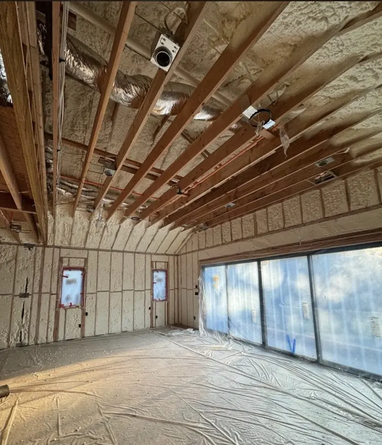 Interior walls and ceiling insulated with spray foam during new construction in Eagan